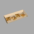 Delicious Four Puff Pastry Snacks With White Icing On White Rectangular Plate