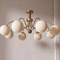 Modern Cream Colored Chandelier With Multiple Spherical Shades Golden Frame And Wooden Top
