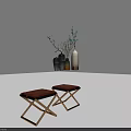 Two Modern Minimalist Stools With Brown Upholstered Seats And Cross Metal Legs