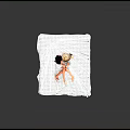 Two dolls with black and blonde hair wearing white tops sitting on white bed sheet