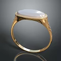 Elegant Gold Ring Featuring White Oval Gemstone And Decorative Side Accents
