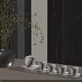 Elegant Tea Set With Teapot And Teacups On Wooden Tray Near Black Vase Plant Dark Wall