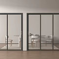 Sliding Doors With Black Frames Transparent Glass And Dining Space Behind Wooden Floor White Walls