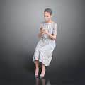 Woman In Plaid Dress And Heels Using Mobile Phone Against Grey Background