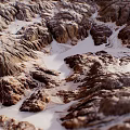 Natural Garden Landscape With Rocky Terrain Sandy Patches And Blue Sky