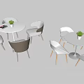 Modern Dining Table And Chair Set With Round Top Colored Seats And Potted Plants
