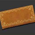 Antique Brown Leather Book With Intricate Gold Embossed Patterns On Cover