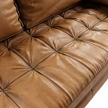 Modern Brown Leather Two Seater Sofa With Tufted Design Rounded Armrests And Black Tapered Legs