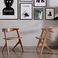 Minimalist Wooden Accent Chairs In Living Room With Decorative Wall Art And Potted Plant