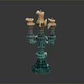 Artistic Ceramic Candelabra Featuring Three Orange Dripping Candles And Blue Base