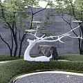 White Branch Shaped Sculpture In Modern Garden With Lawn Trees And Stone Wall
