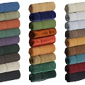 Soft Colorful Bed Runners Rolled Stacked in Various Vibrant Hues for Bedroom Decor
