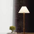 Modern Table Lamp With Metal Pole Square Base White Lampshade Near Books And Potted Plant