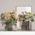 Transparent Vases With Yellow Chrysanthemums And White Roses On Light Colored Tabletop With Mirror