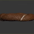 Golden Brown Ring Shaped Pastry With Textured Surface And White Cream Filling
