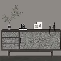 Modern Entryway Console Cabinet With Textured Doors Drawers Decorated Vase Green Plant Picture Frames Sculpture