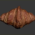 Freshly Baked Flaky Croissant With Golden Buttery Layers On Dark Background