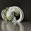 Floral Display Installation With White Circular Rings And White Pink Flowers Around Logo