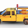 Yellow Lifeguard Truck With Surfboard And Rescue Equipment On Roof Displaying Lifeguard Logo