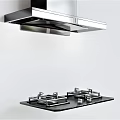 Modern Kitchen Cooking Appliances Featuring Stainless Steel Range Hood And Gas Stove