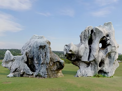 Unique Shaped Stone Garden Ornaments On Green Grassland With Blue Sky And Distant Hills 3d model