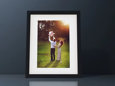 Framed Family Portrait Of Parents Lifting Baby In Sunset Grass Field 3d model