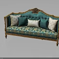 Classic Turquoise Sofa With Ornate Golden Carvings And Patterned Fabric Pillows