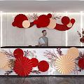 Reception Desk With Red Beige Paper Fans Decorations Plants And Lighting
