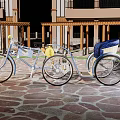Vintage Silver Tricycle Parked On Stone Pavement By Building With Columns