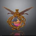 Golden Decorative Ornament With Intricate Wings And Circular Sphere Containing Pink Flame In Ornate Frame