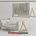 Modern Minimalist Baby Crib With Light Gray Soft Fabric Headboard And Wooden Triangle Legs