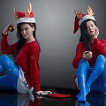 Cute Children in Red Sweaters Blue Snowflake Tights With Christmas Hats Reindeer Antlers and Gifts