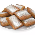 Golden Brown Square Fried Pastries Topped With Powdered Sugar On White Plate