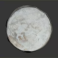 Rusted Metal Barrel With White Lid And Blue Text On Dark Background