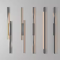 Modern Wall Lamps Featuring Various Black And Gold Designs With Warm Light On Gray Wall