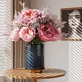 Modern Decorative Arrangement With Black Vase Pink Peonies And Framed Painting On Round Table