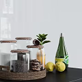 Kitchen Storage Glass Jars with Wooden Lids in Wicker Tray and Green Bottle Lemons