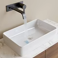 Modern White Vessel Sink with Black Wall Mounted Faucet on Marble Countertop and Wooden Cabinet