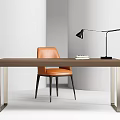 Modern Brown Table With Metal Legs And Orange Leather Chair Black Desk Lamp And Books