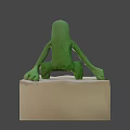 Green Plush Game Movie Character Sitting With Big Eyes Open Mouth And Teeth