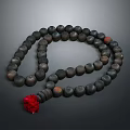 Round Black Beads Necklace With Red Flower Accent On Dark Background