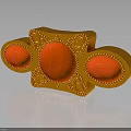 Golden Decorative Object Featuring Oval Shaped Red Gemstones and Ornate Patterns