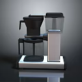 Modern Coffee Maker Machine With Transparent Water Tank Black Silver Base Contemporary Kitchen Appliance Design