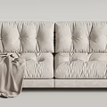 Black and Cream Two-Seater Sofa with Plush Cushioned Design and Throw Blanket