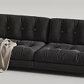 Black and Cream Two-Seater Sofa with Plush Cushioned Design and Throw Blanket