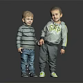 Two Little Boys Holding Hands In Casual Outfits