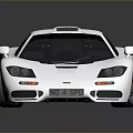 Silver Sleek Sports Car With Black Wheels And Glossy Surface Reflection