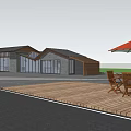 Waterside Inn with Lush Trees Outdoor Seating and Umbrellas for People Relaxing by Water