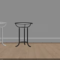Modern Glass Top Side Tables With Silver And Black Metal Frames In Indoor Corner