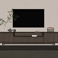 Modern Wooden TV Stand With Woven Doors And TV On Top With Decorative Items